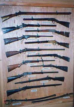 Gun display, all pictured are Plains Indian guns, from Indian wars or early reservations.